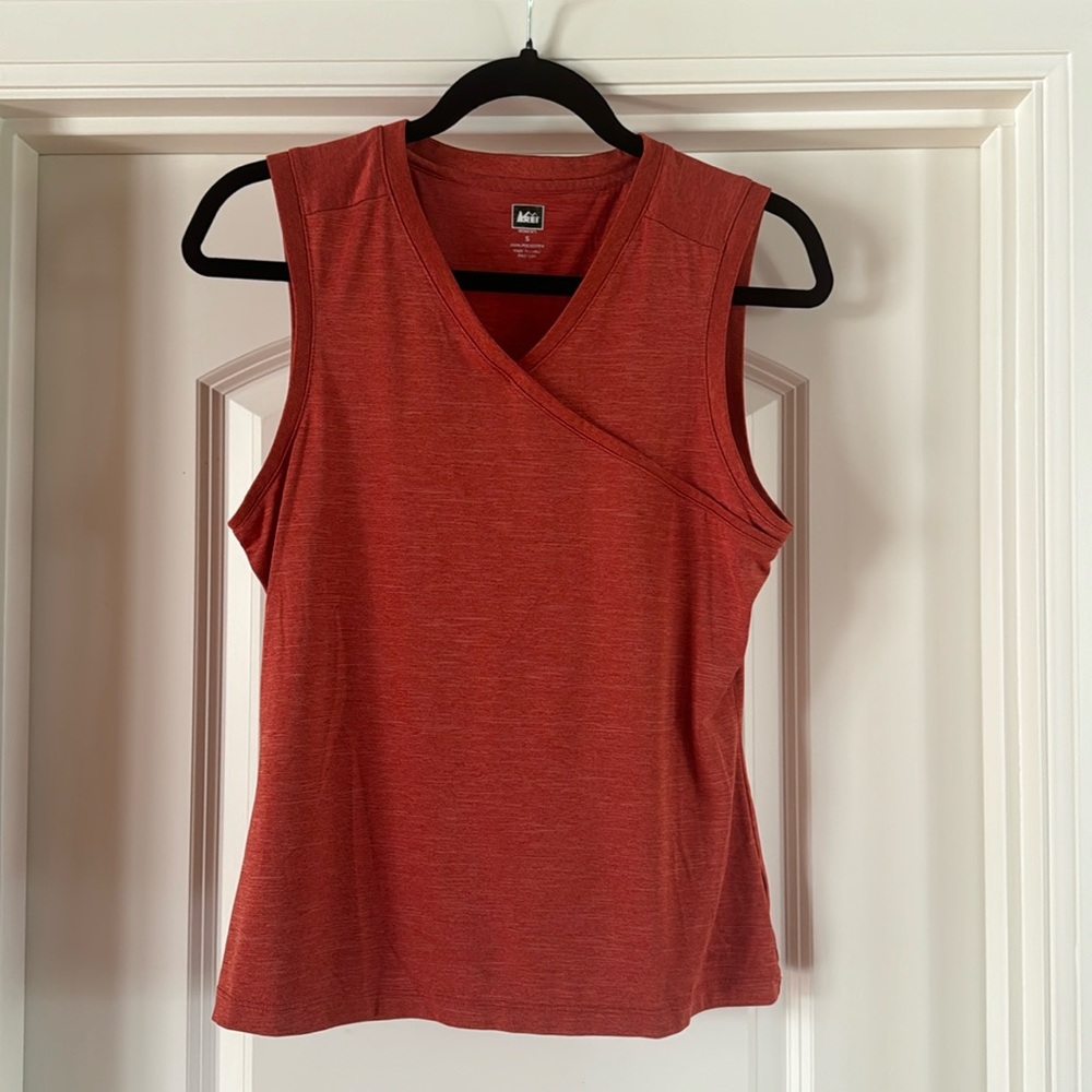REI terracotta orange sleeveless v-neck shirt.